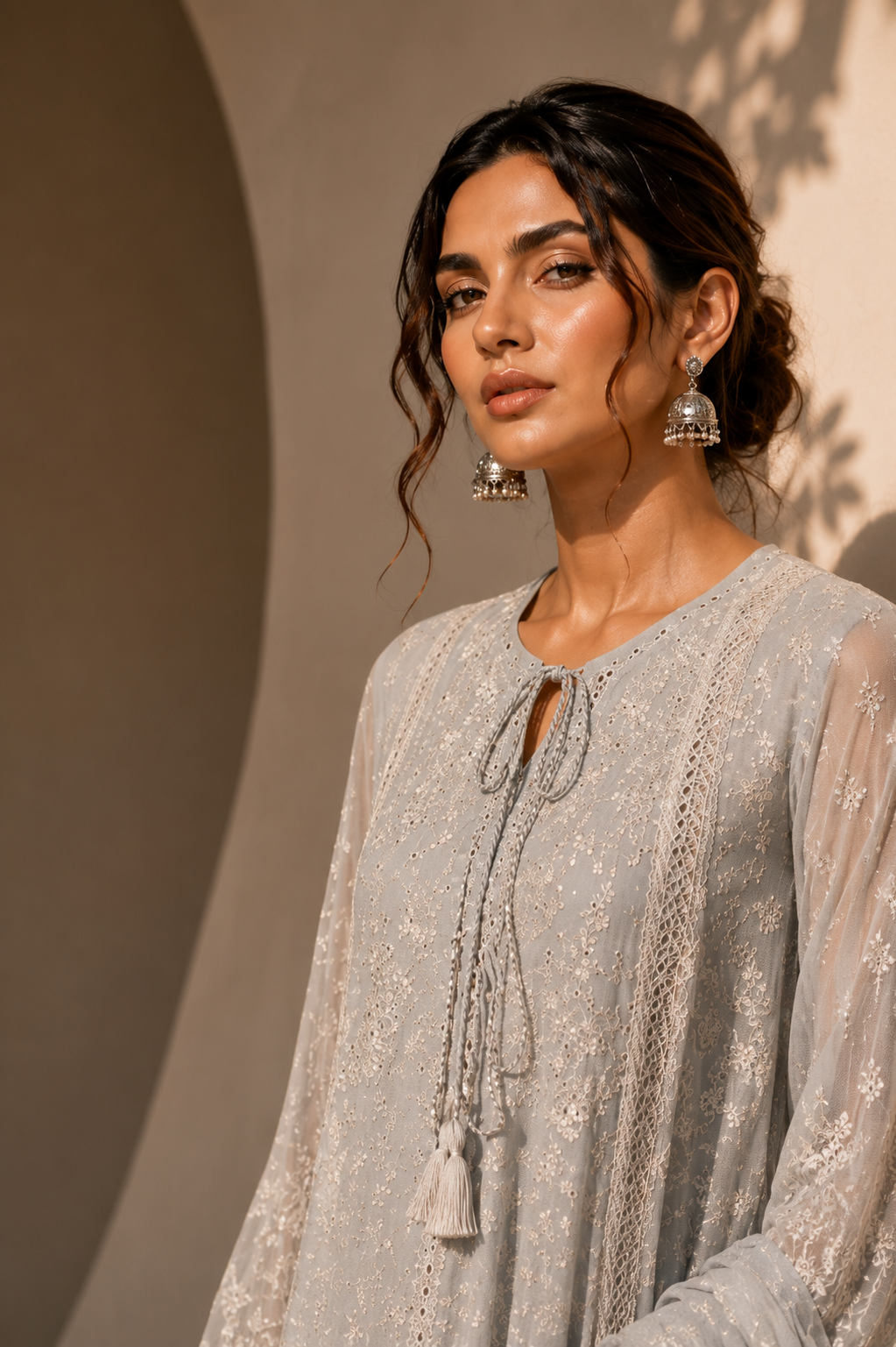 Model in a blush pink lace LIMA formal outfit